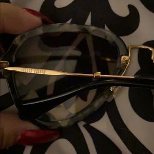 Miu Miu sunglasses.